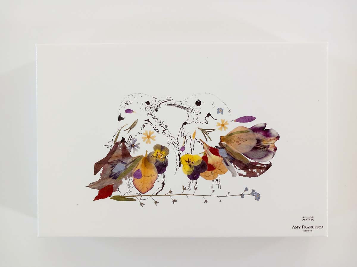 Canvas print featuring an illustration of two birds facing each other, placed on a white background.