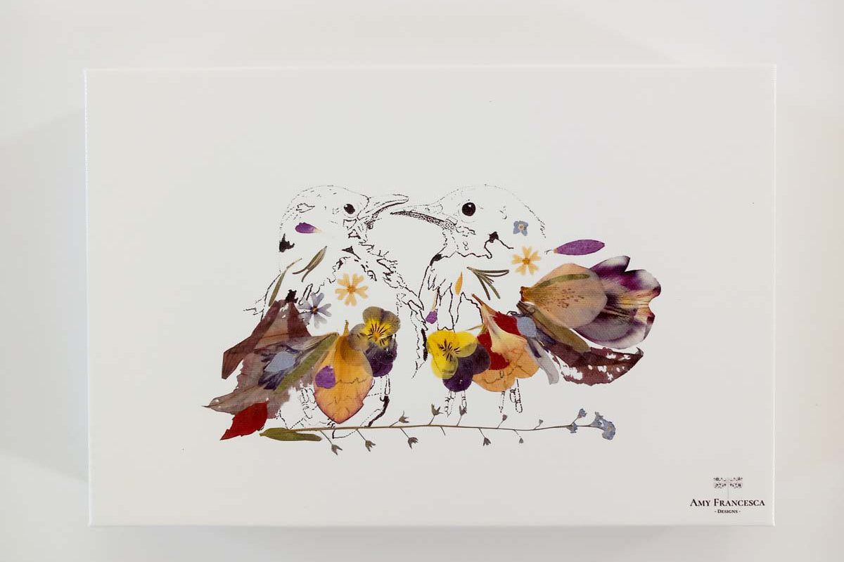 Canvas print featuring an illustration of two birds facing each other, placed on a white background.