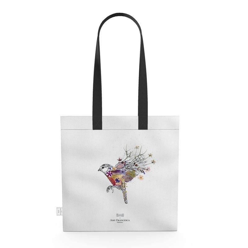 Tote bag featuring a bird illustration with multicoloured detailing on a white background with black handles.